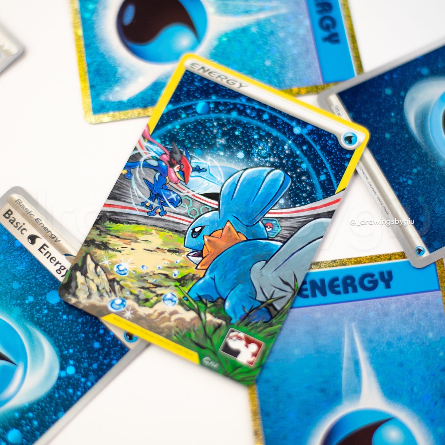 Hand-painted Mudkip vs Ash Greninja on Pokémon card by Giu Magnani.