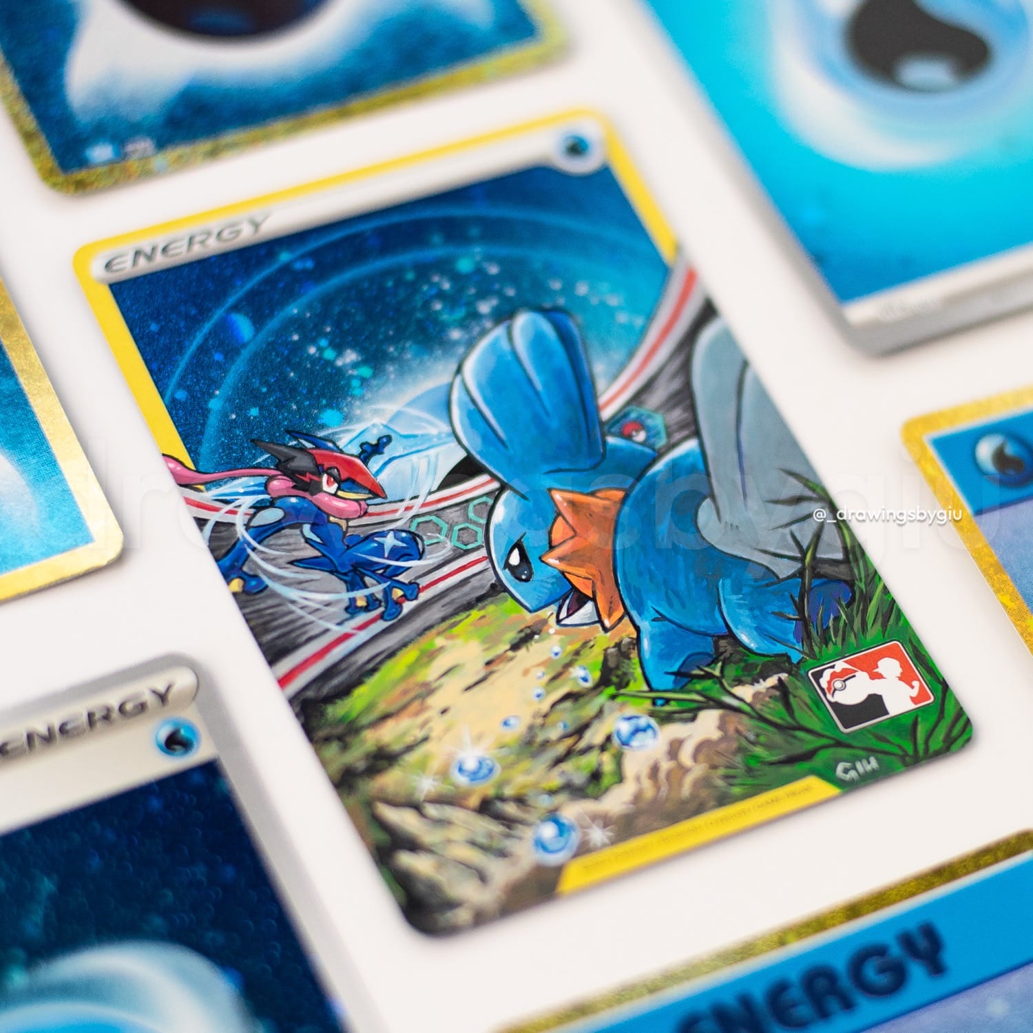 Hand-painted Mudkip vs Ash Greninja on Pokémon card by Giu Magnani.