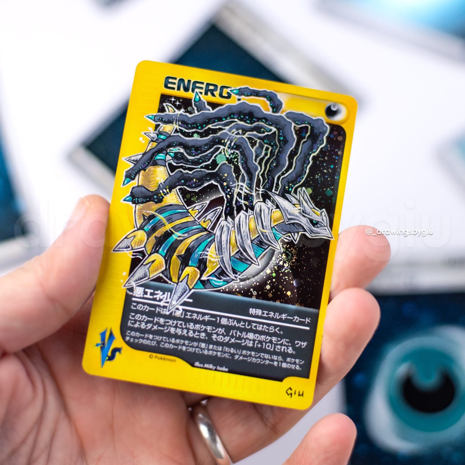 Hand-painted Shiny Giratina on Pokémon card by Giu Magnani.