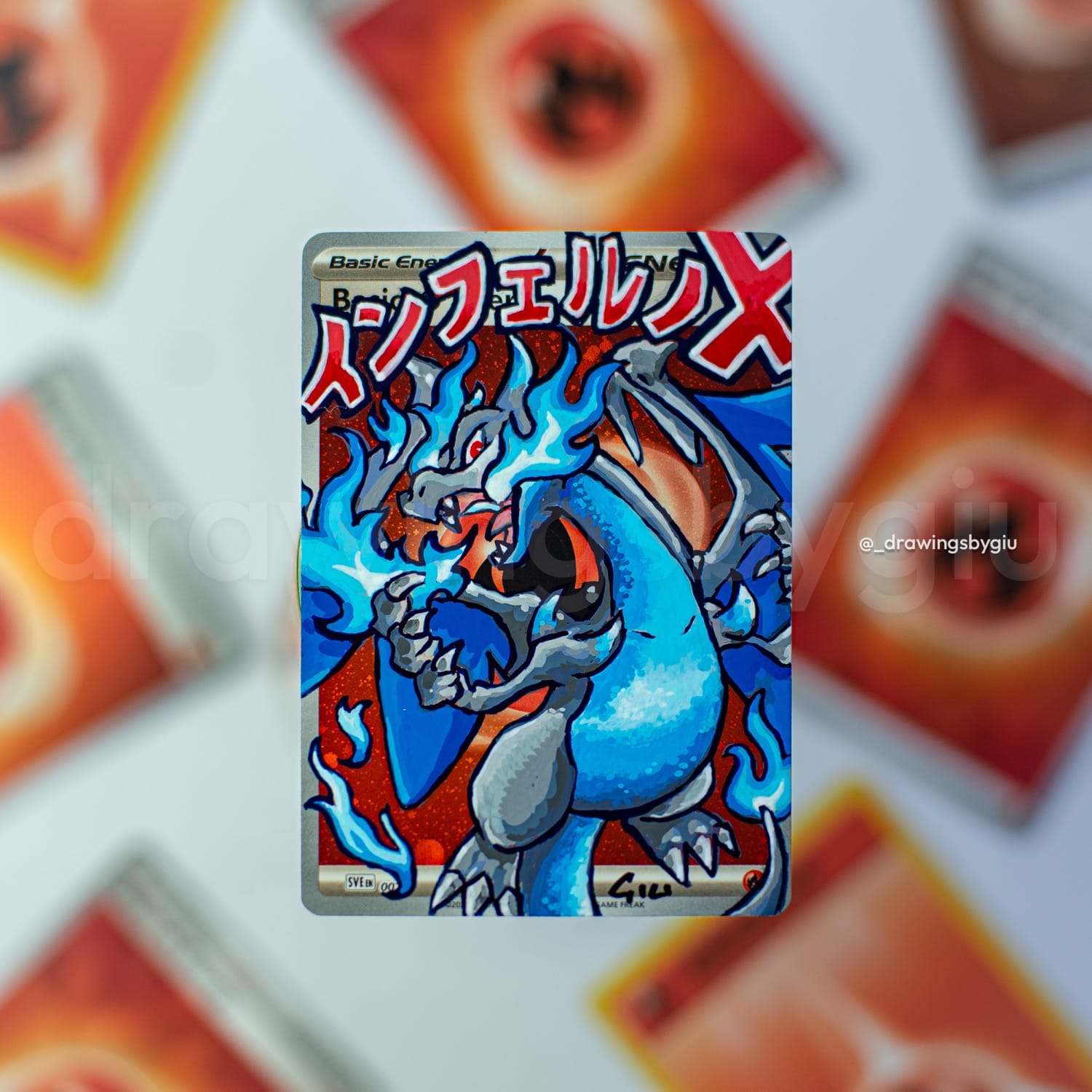 Hand-painted Mega Charizard X on Pokémon card by Giu Magnani.
