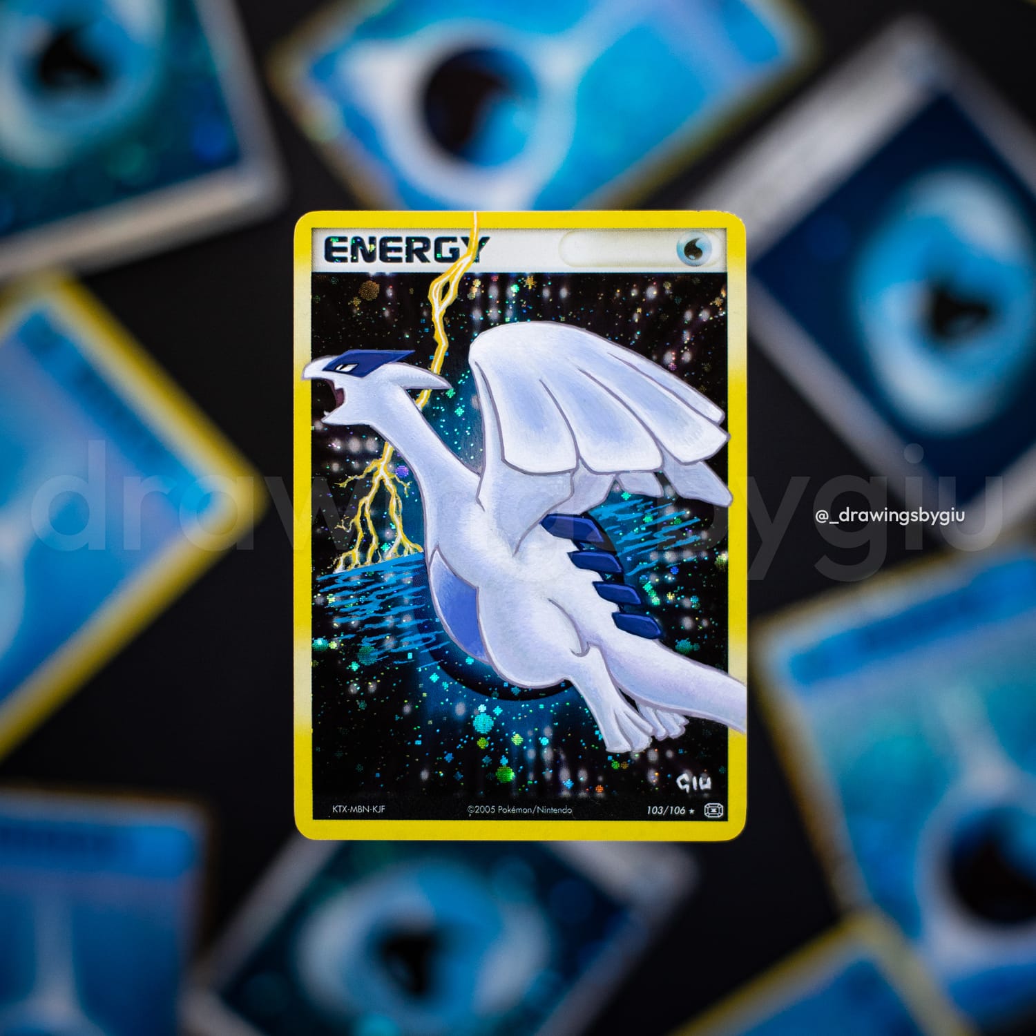 Hand-painted Crystal Lugia on Pokémon card by Giu Magnani.