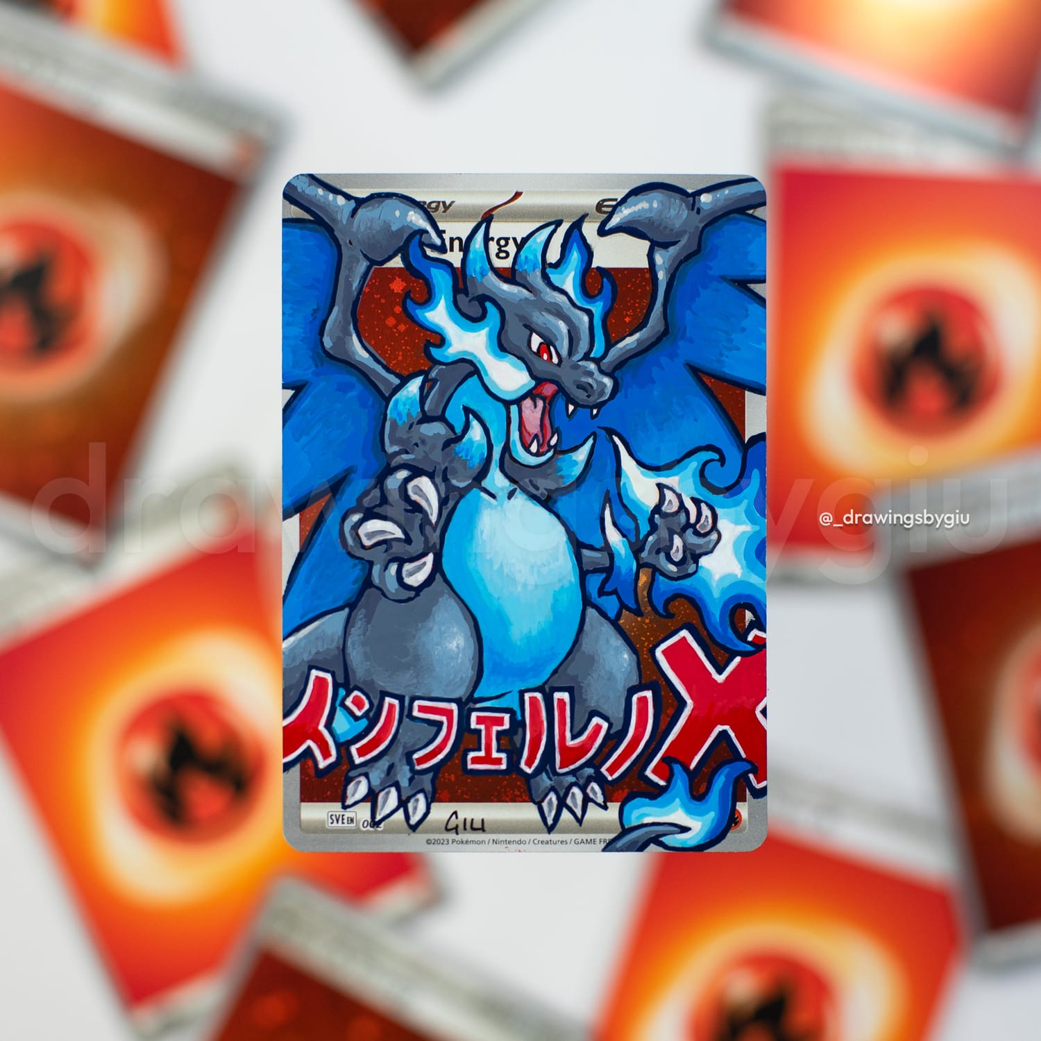 Hand-painted Mega Charizard X on Pokémon card by Giu Magnani.