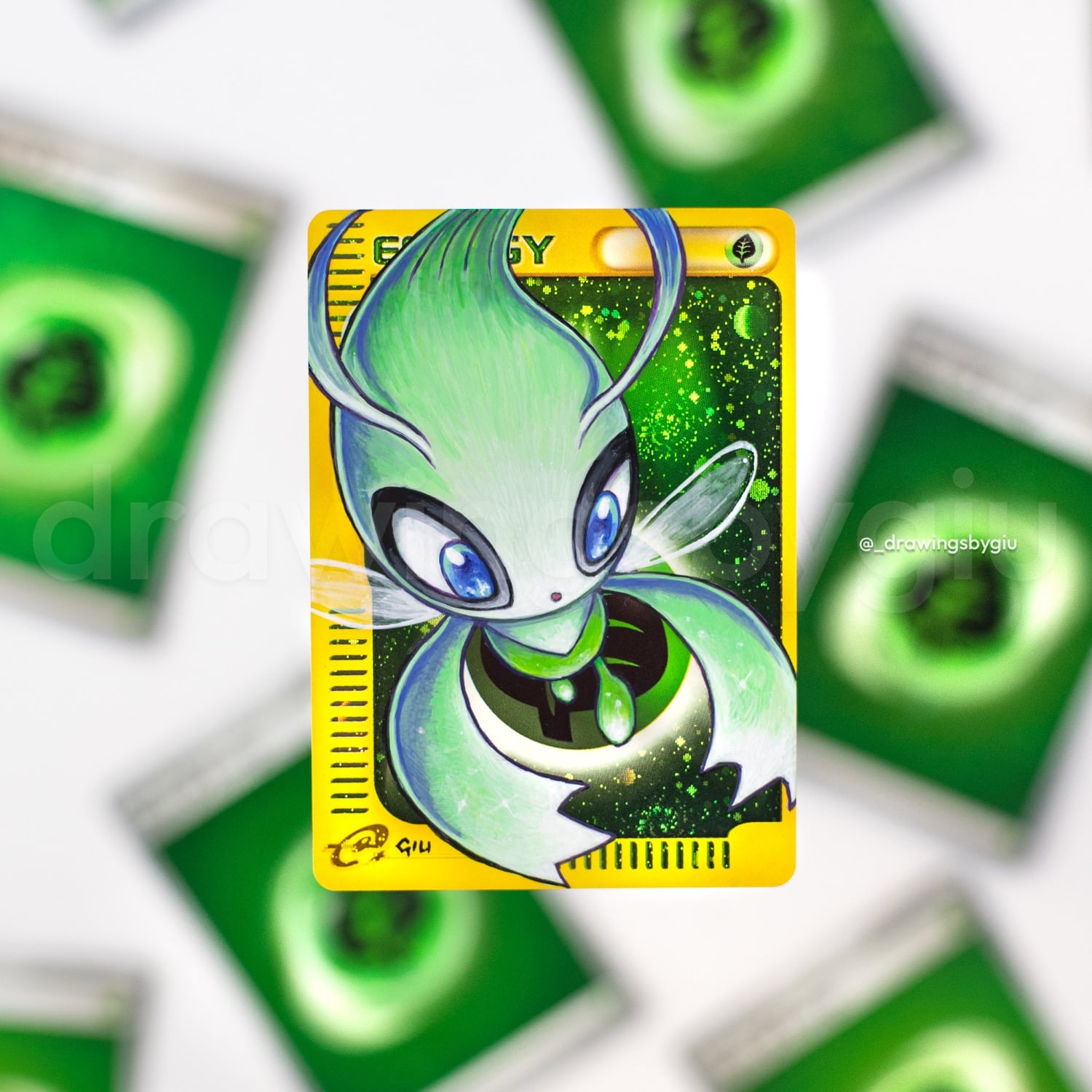 Hand-painted Celebi on Pokémon card by Giu Magnani.