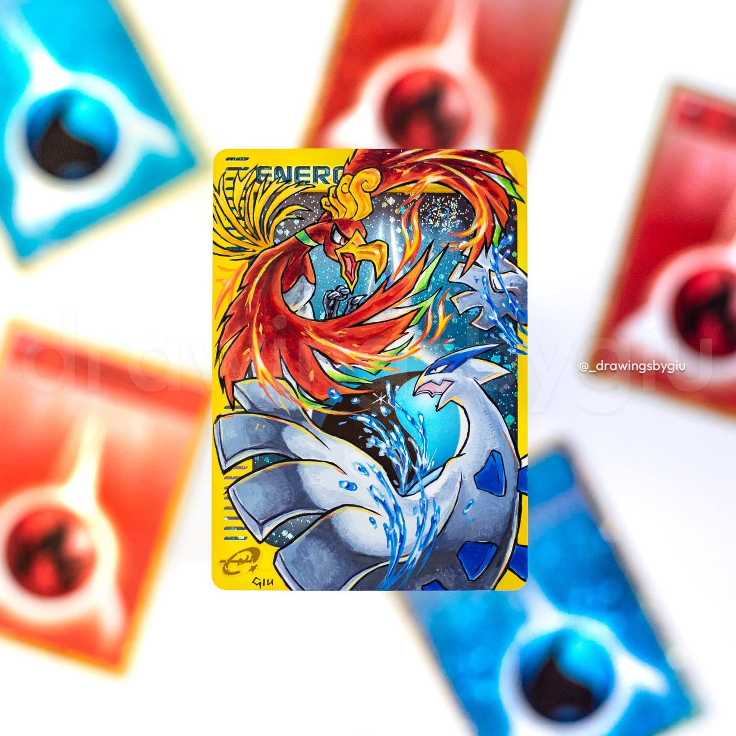 Hand-painted Ho-Oh vs Lugia on Pokémon card by Giu Magnani.